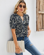 Hazel Top Donna – Bluză tunică florală cu decolteu în V, mâneci bufante și pliuri