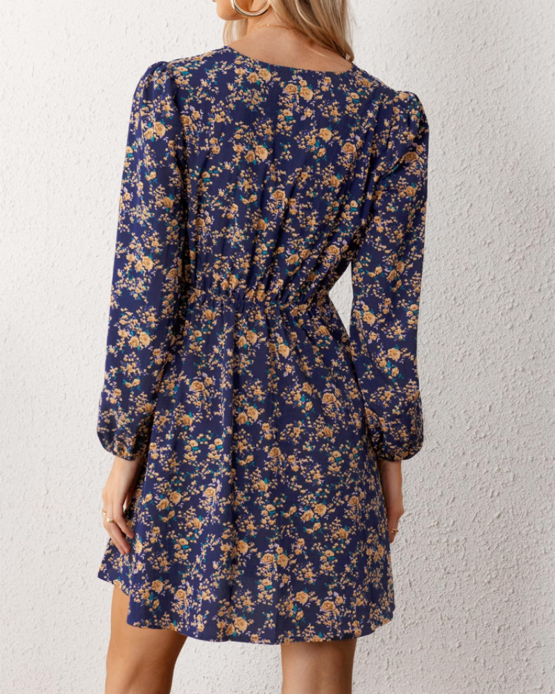 Megan Abito Donna – Mini kjole med blomsterprint, krydset halsudskæring, elastisk talje og lange ærmer